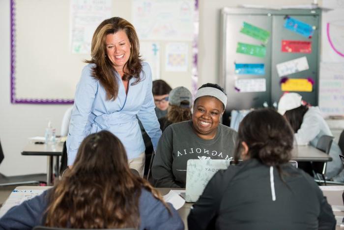 A professor helping students.